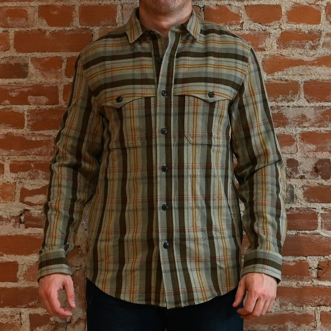 View of Pendleton men’s wool Weston Pawpine shirt in green and brown plaid with elbow patches