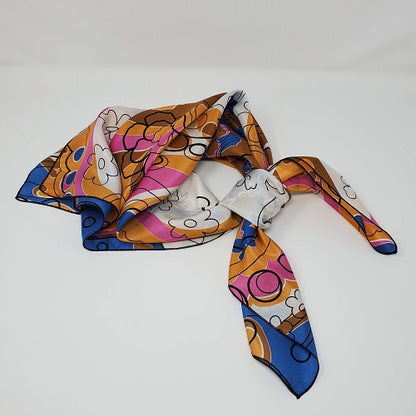 Cowboy Images 44×44 silk wild rag in toffee, caramel and pink tones