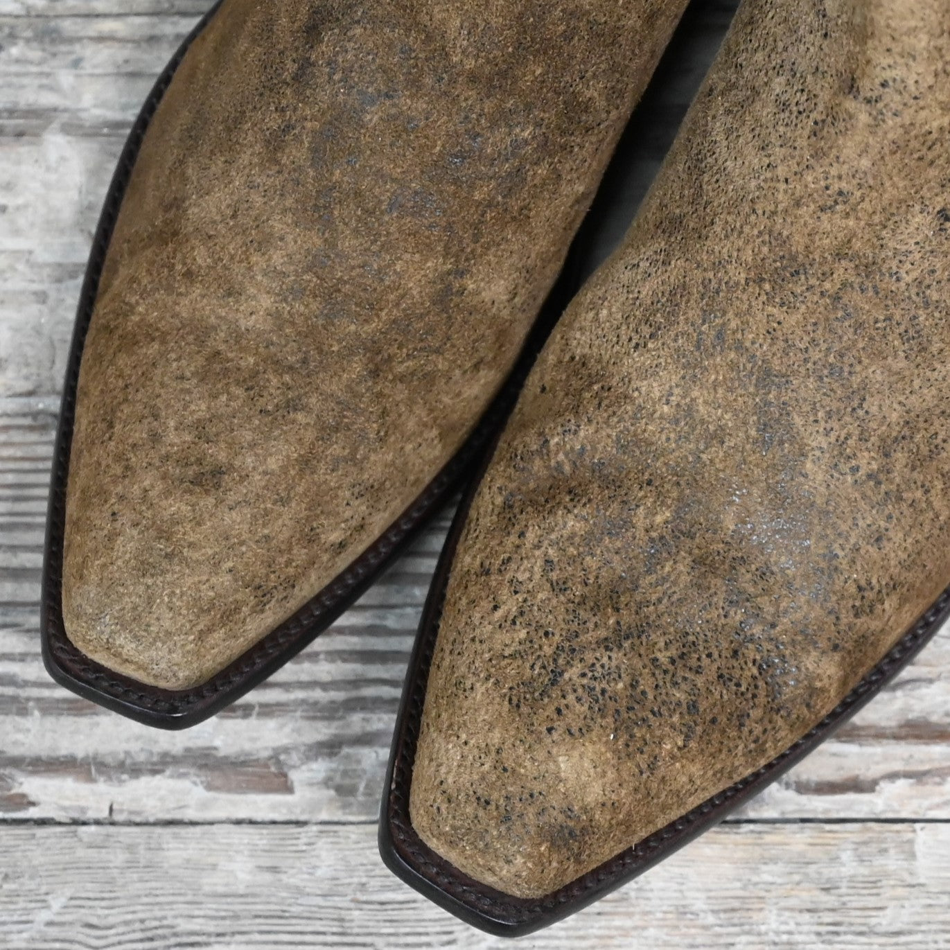 View of Stallion snip‑toe ankle boot in distressed camel kid with chocolate buckstitching and side zipper