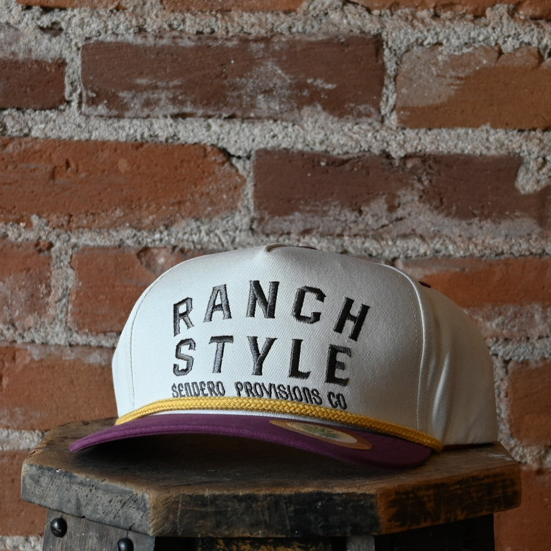 Sendero Ranch Style Hat with embroidered front, rope visor detail, and snapback closure.