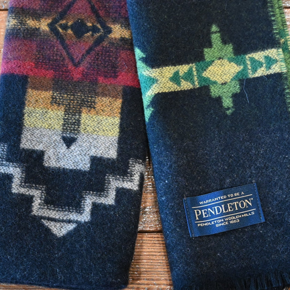 View of Black Pendleton scarf with Four Corners jacquard pattern and fringe