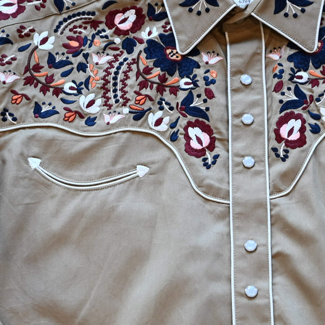 View of Rockmount men’s khaki Western shirt with floral embroidery and classic yoke styling