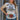 View of Double D Ranch Western Slick Up Tee featuring a bold graphic design by Bruce Lee Webb with colorful stripes and contrasting collar and cuffs