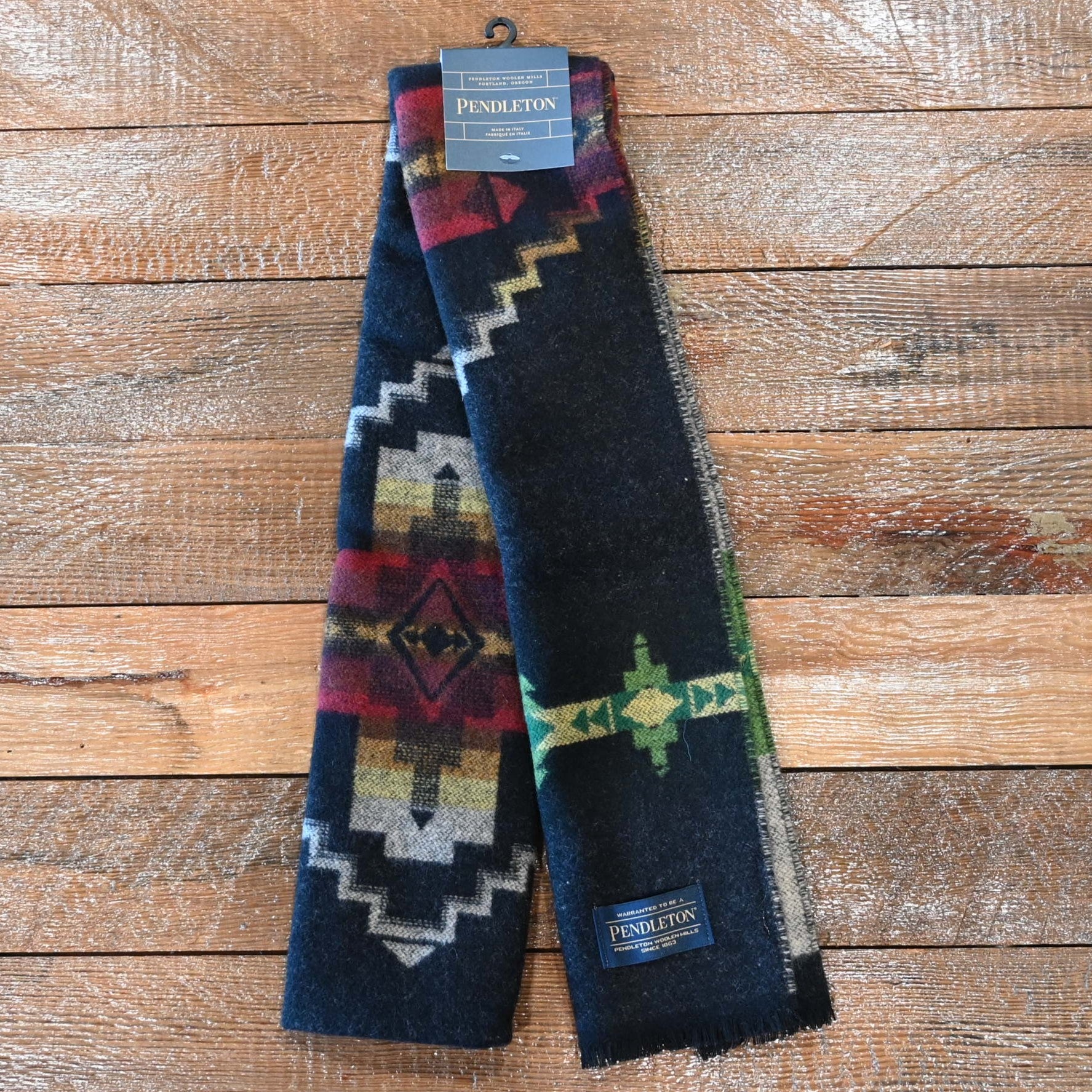 View of Black Pendleton scarf with Four Corners jacquard pattern and fringe