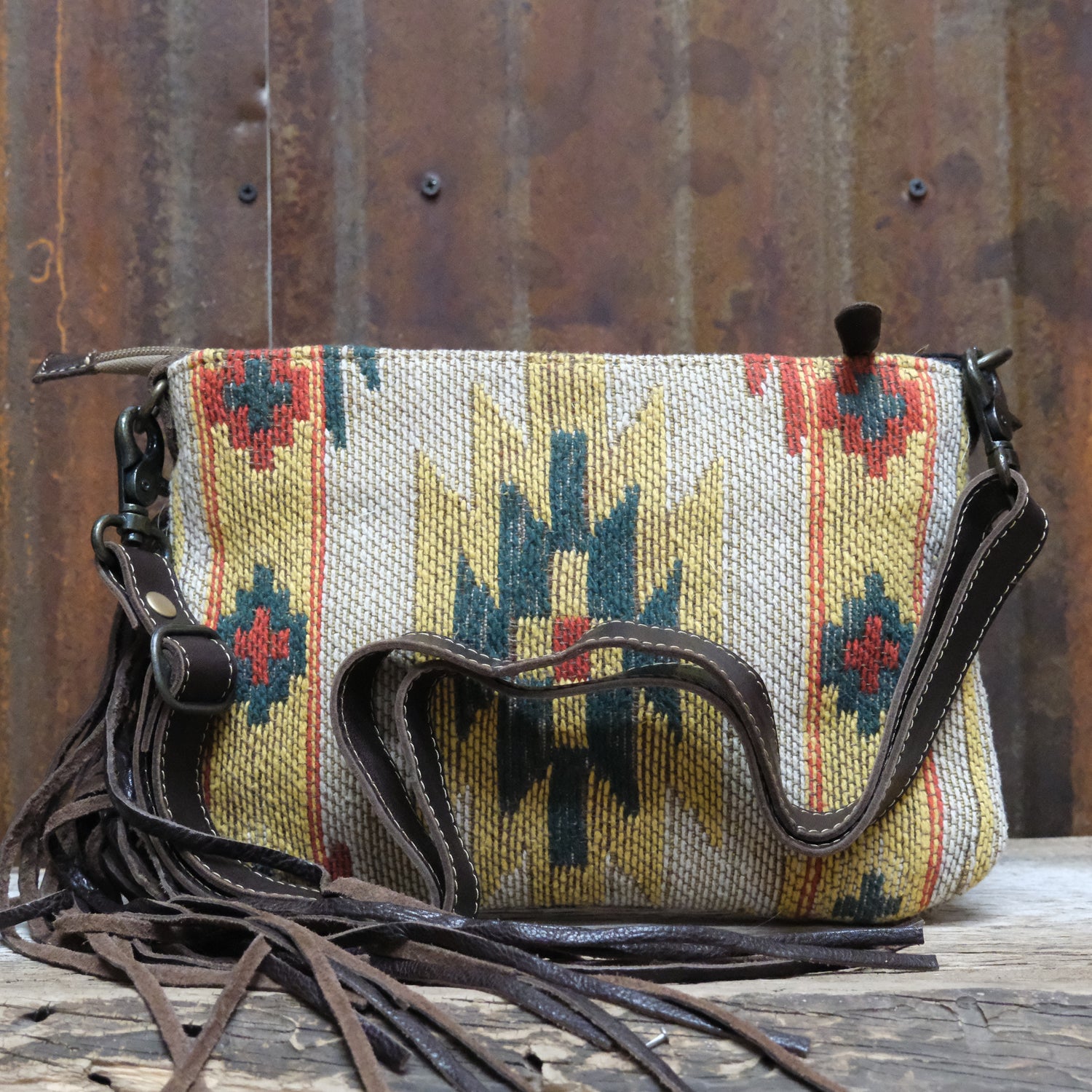 Myra yellow leather hand tooled bag with roomy interior and top closure