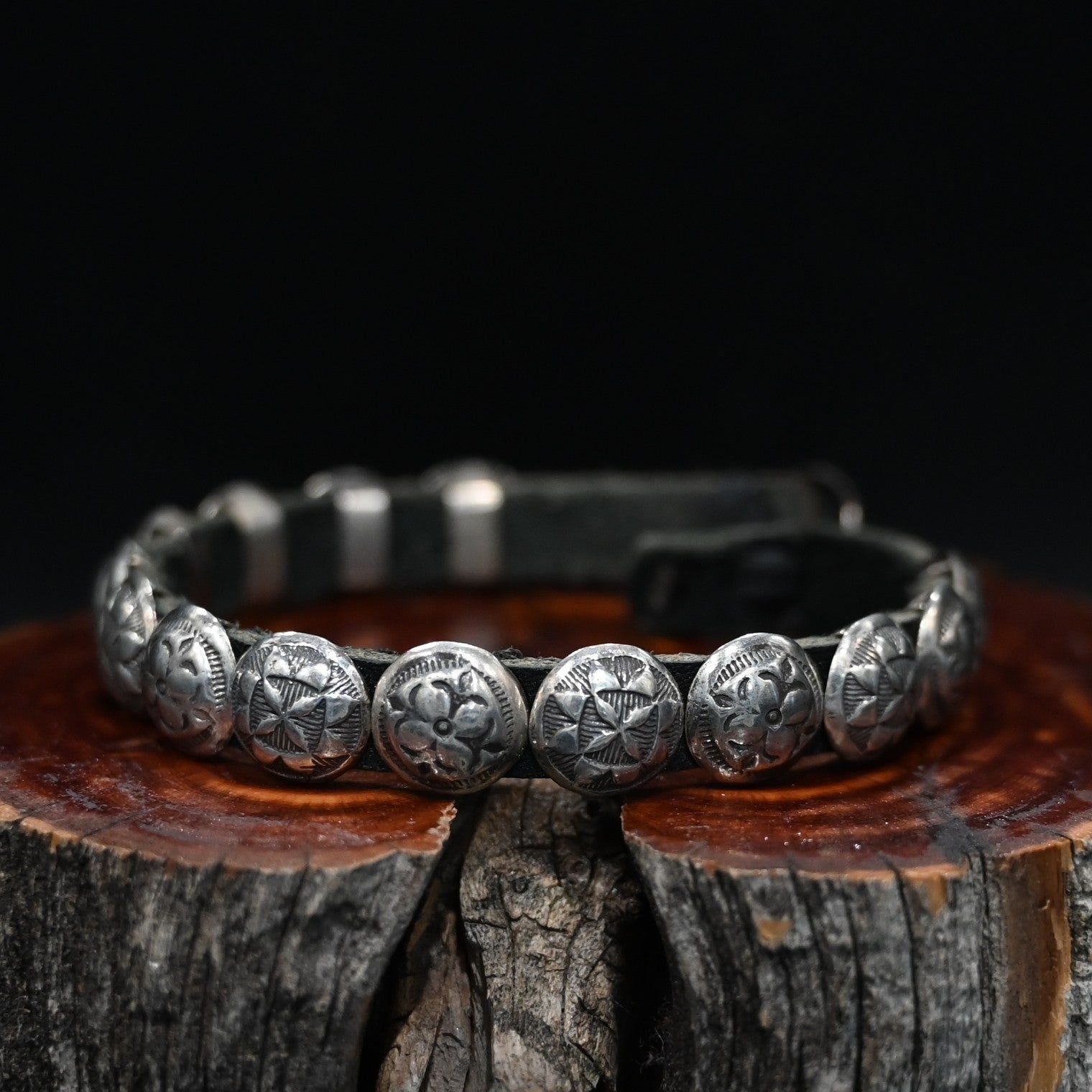 View of Sunwest Silver Leather Concho Bracelet featuring leather strap with sterling silver conchos and a concho clasp
