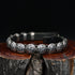View of Sunwest Silver Leather Concho Bracelet featuring leather strap with sterling silver conchos and a concho clasp