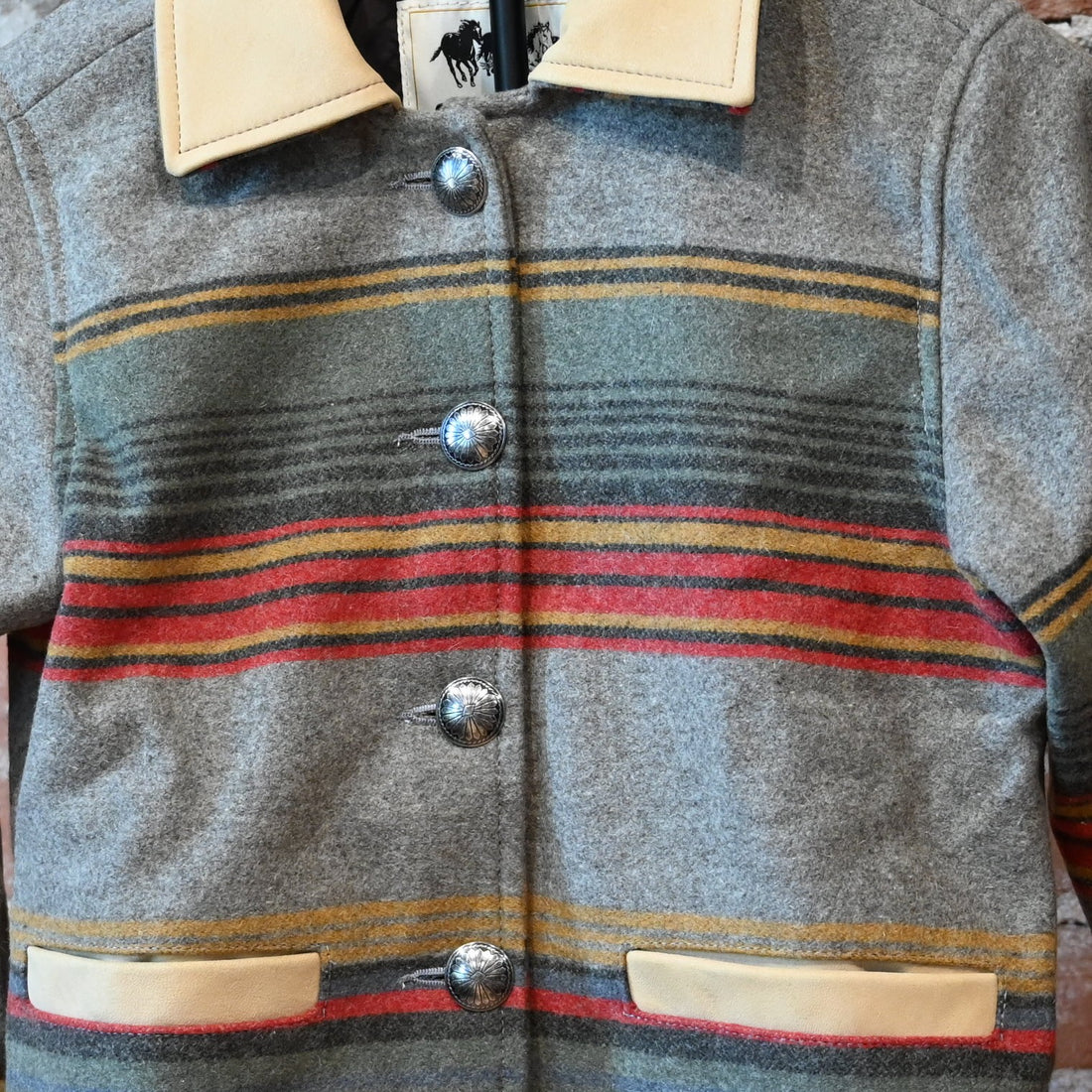 Schaefer Outfitter Ladies Las Cruces Jacket in taupe stripe wool with lamb suede collar and concho buttons