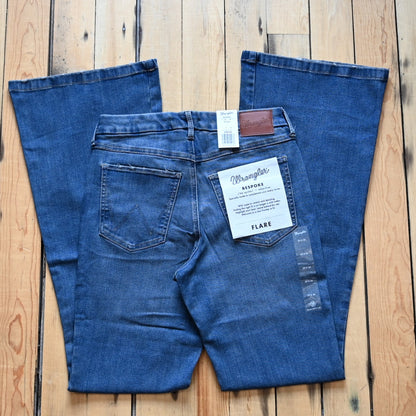 View of Wrangler Ladies flare jeans in Lily wash with high-rise waist and slim fit from the Bespoke Collection