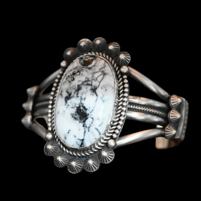 View of Sunwest Silver Michael Calladitto White Buffalo Cuff featuring a large White Buffalo stone with intricate sterling silver detailing