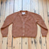 View of Filson Ladies Rustic Cotton Cardigan in Chestnut featuring a V-neckline and four-button front closure