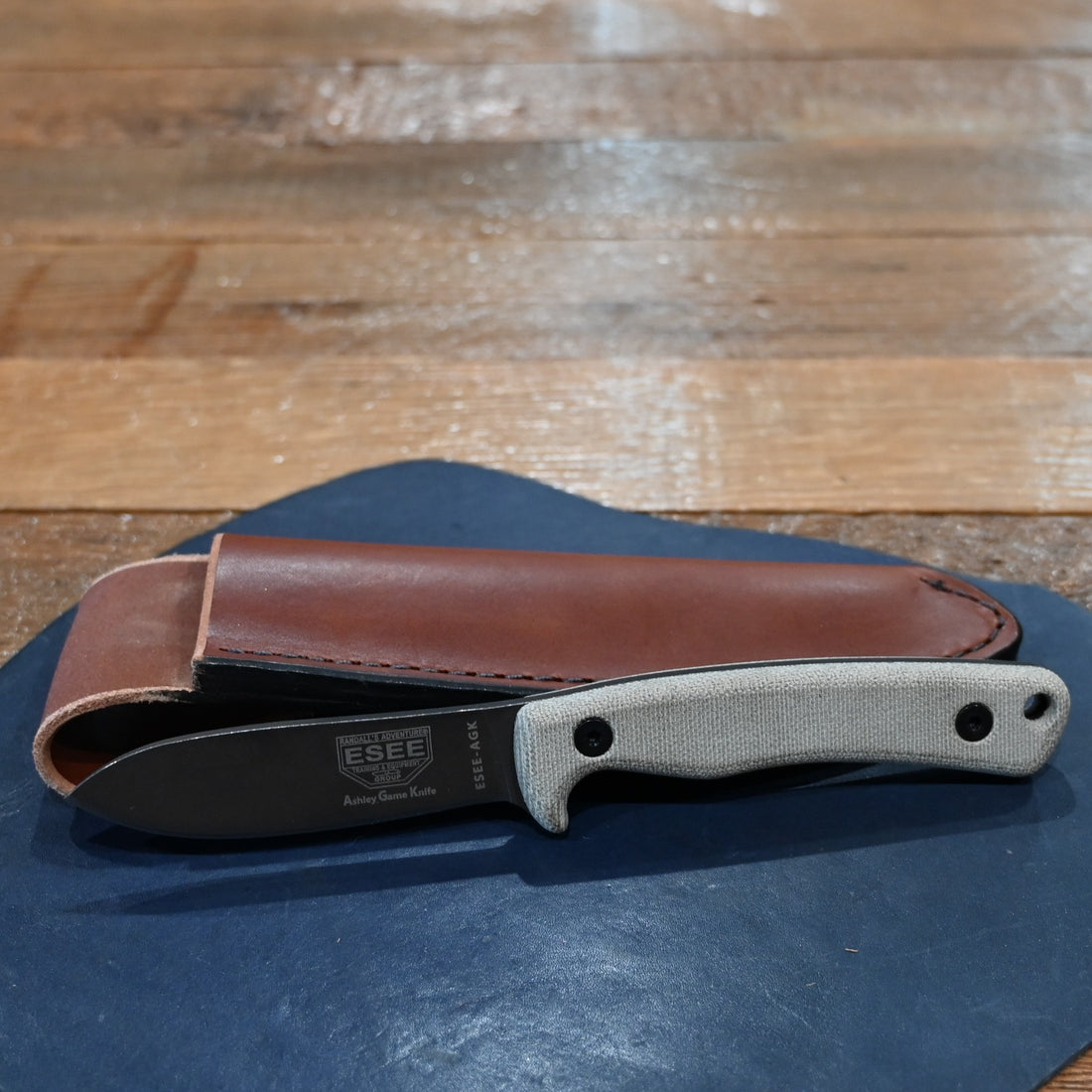 ESEE Ashley Emerson hunting knife with 1095 carbon steel blade and leather sheath, 2025 edition