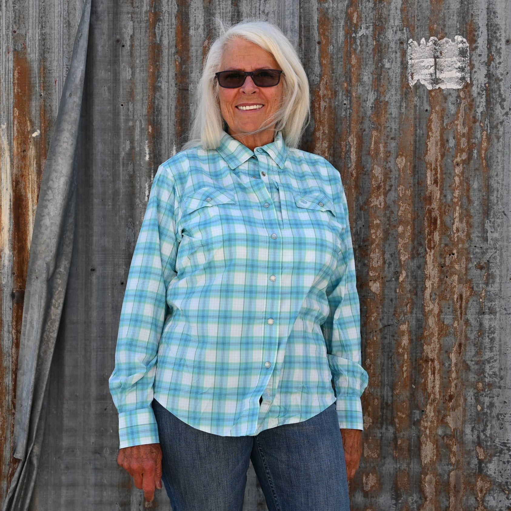 View of Schaefer blue &amp; green plaid Range Tek shirt with snap front and mesh back vent