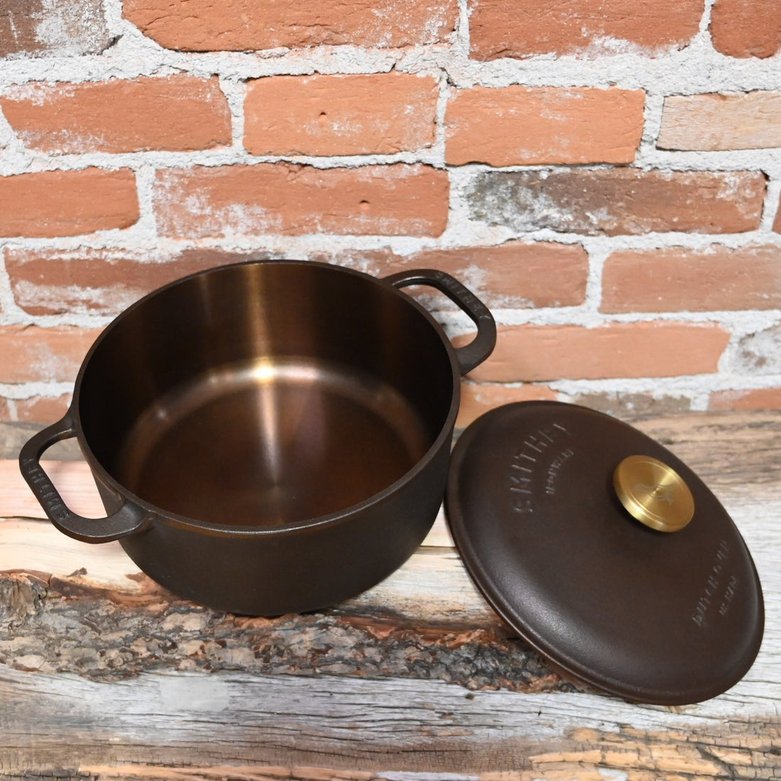 View of Smithey 3.5 Qt Cast Iron Dutch Oven with polished interior and brass knob