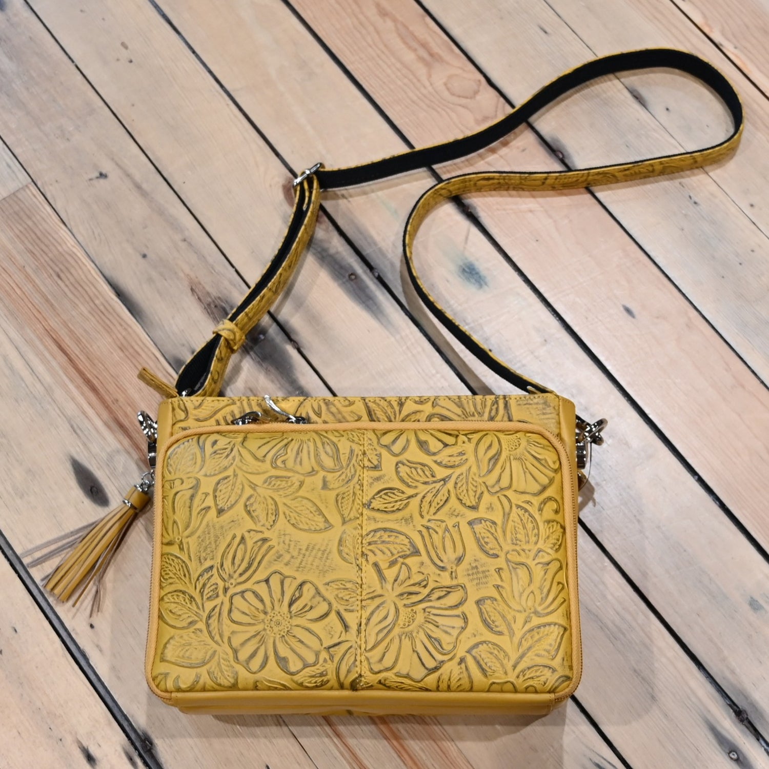 Mustard debossed USA cowhide conceal carry clutch by Gun Toten Mamas with rose leaf pattern and zipper access