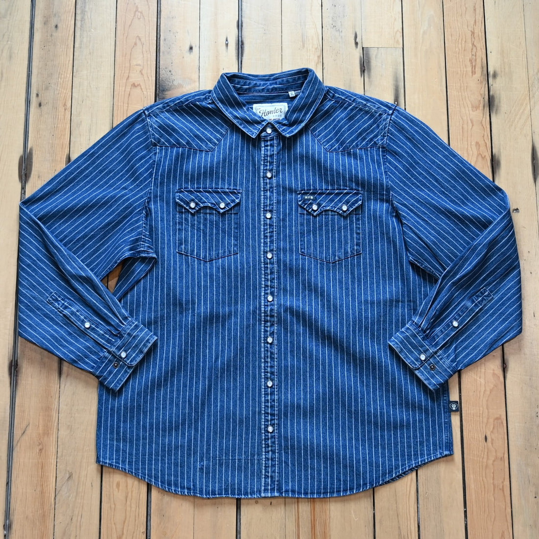 Howler Bros Dust Up Denim Snapshirt in Merle Stripe with pearl snaps and Western detailing