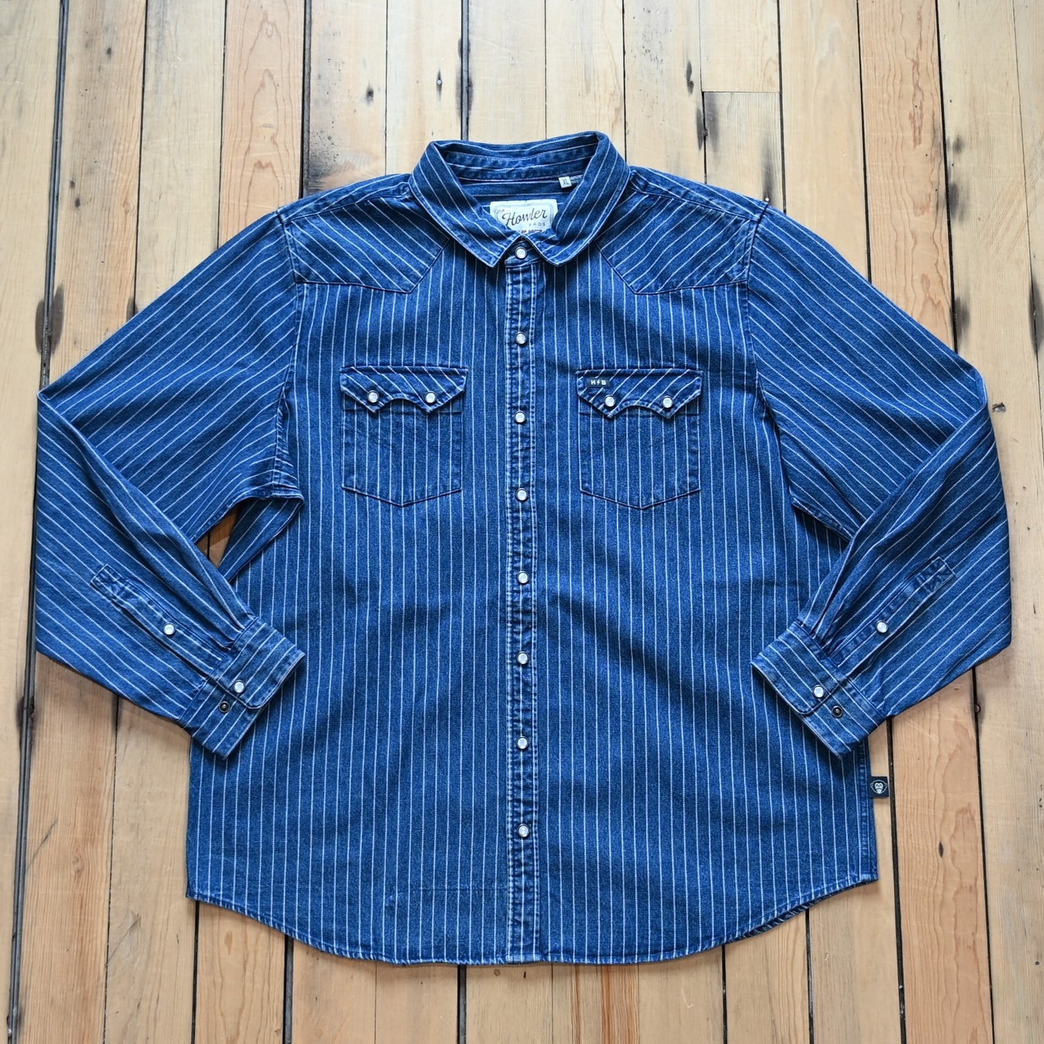 Howler Bros Dust Up Denim Snapshirt in Merle Stripe with pearl snaps and Western detailing