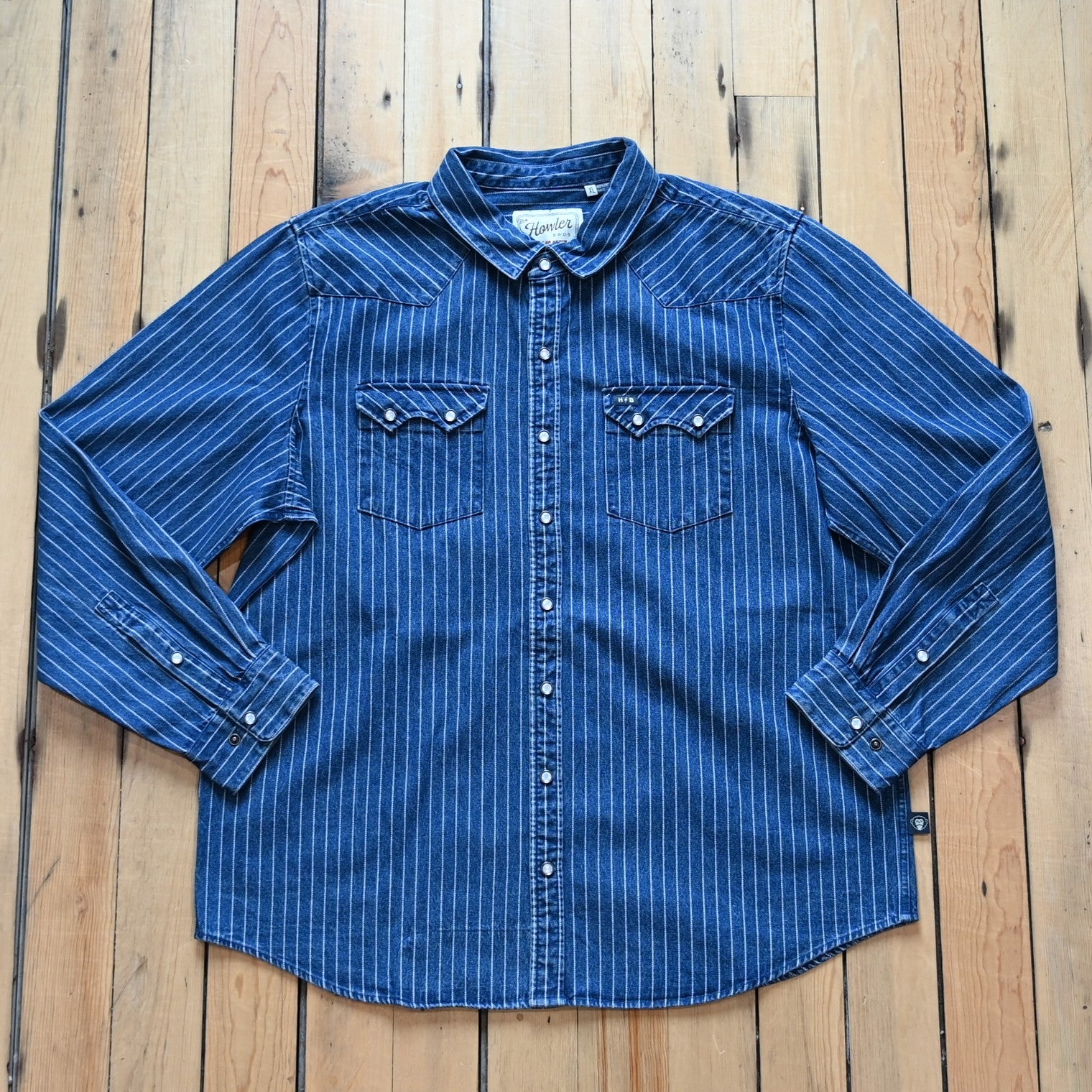 Howler Bros Dust Up Denim Snapshirt in Merle Stripe with pearl snaps and Western detailing