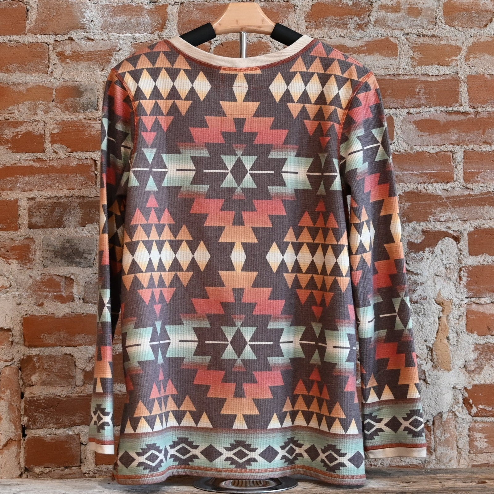 View of Double D Ranch Cowboy Bedroll Top featuring custom geometric print in autumn hues
