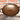 View of Smithey Ironware Carbon Steel Wok with hand-hammered surface and gooseneck handle