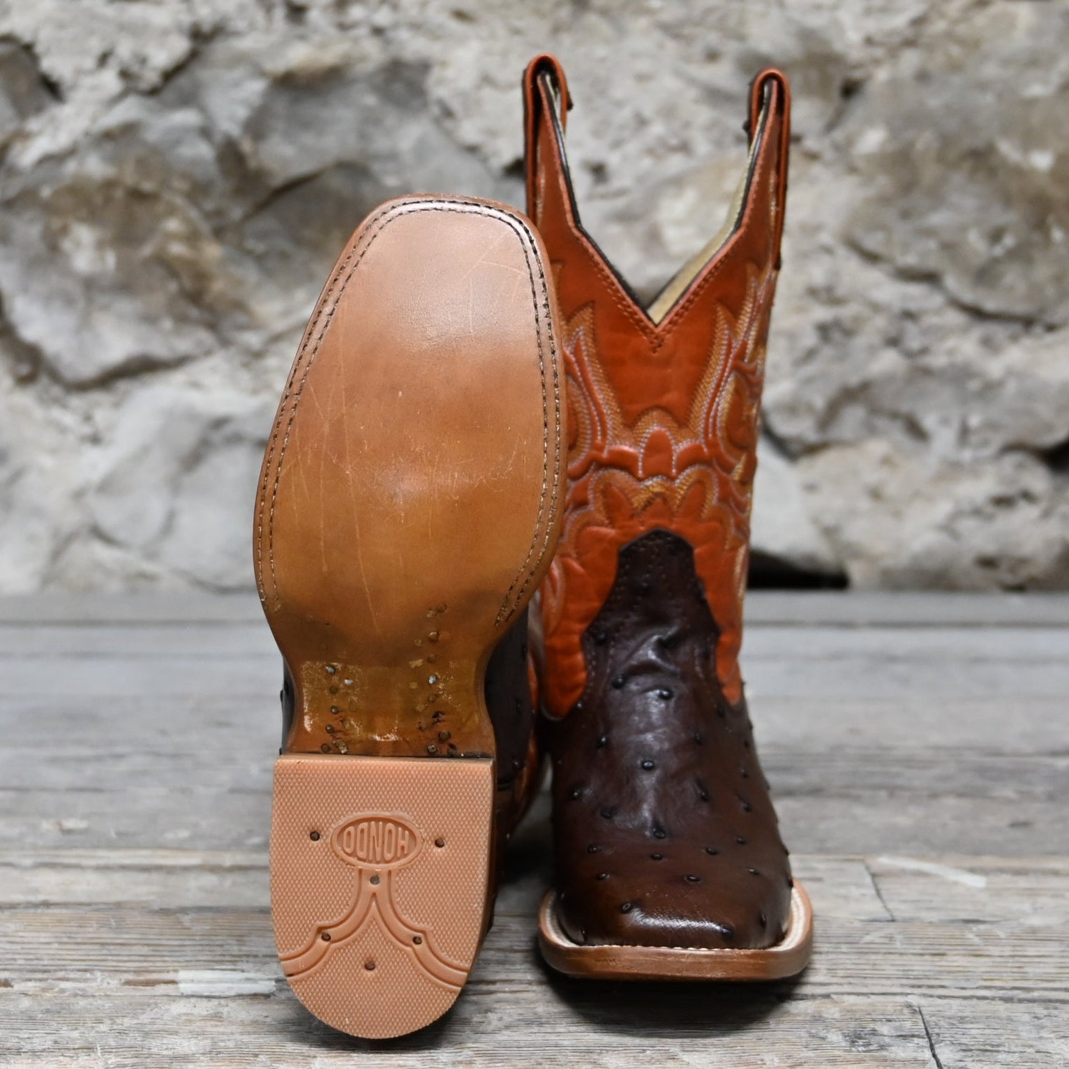 View of Hondo 11&quot; cowboy boot with orange volcano top, brown full quill ostrich vamp, and medium square toe