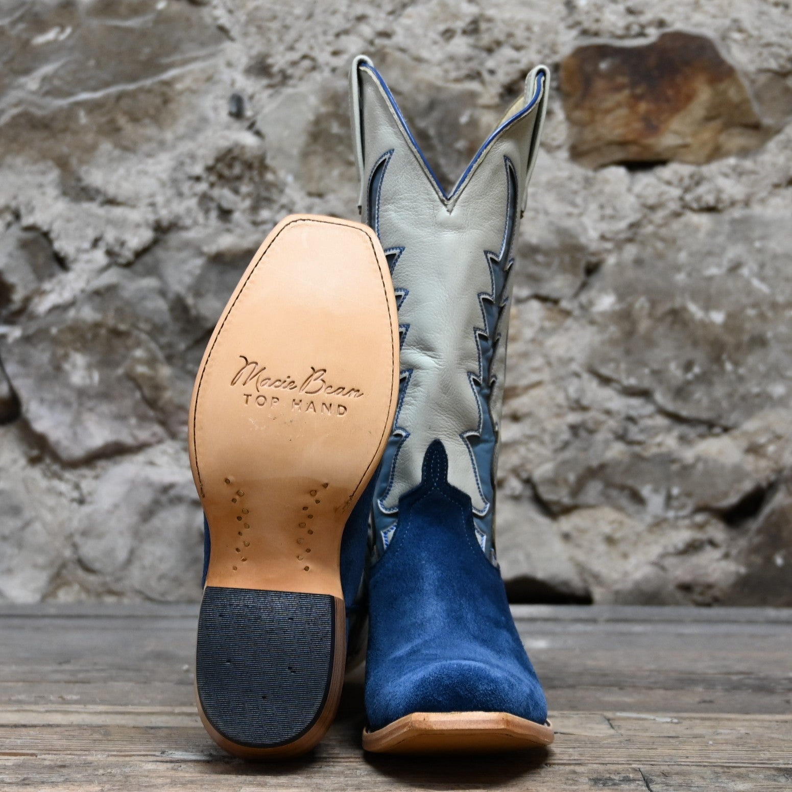 View of Macie Bean Top Hand 13″ boot with blue suede vamp and cream Mercedes-stitched top