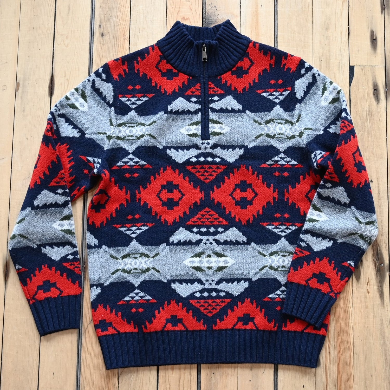 View of Pendleton men’s Nehalem lambswool ¼‑zip sweater in navy and red with geometric pattern