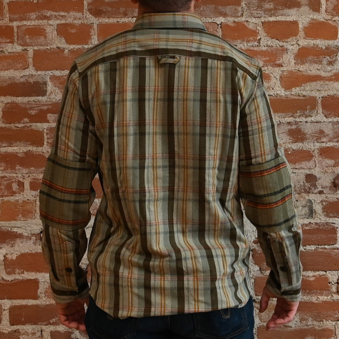 View of Pendleton men’s wool Weston Pawpine shirt in green and brown plaid with elbow patches
