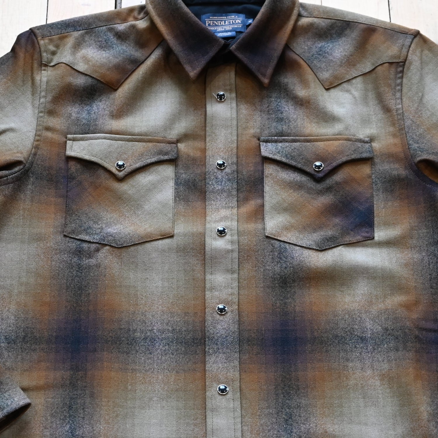 View of Pendleton men’s Canyon shirt in olive and brown ombré wool with snap front and Western yokes