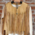 View of Double D Ranch Sonora Vest in Straw featuring full-length fringe and tonal leather lacing details