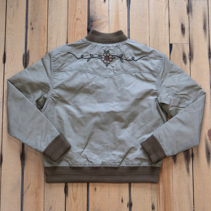 Filson Ladies Western Satin Jacket in Silver Sage featuring embroidered western yokes and a snap-front design.