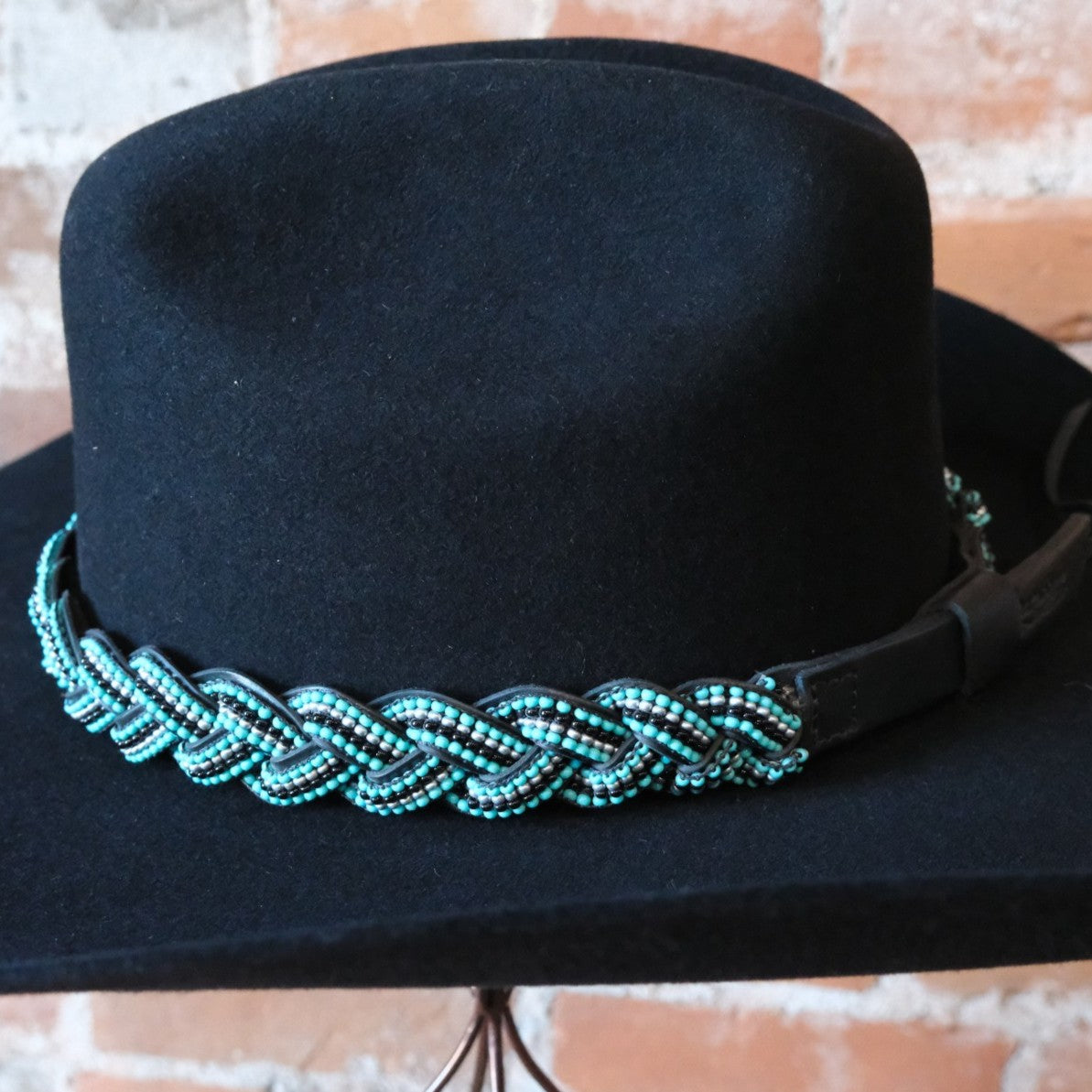 Sambboho Saint Barth hatband featuring blue and silver beads on a braided black full-grain leather base.