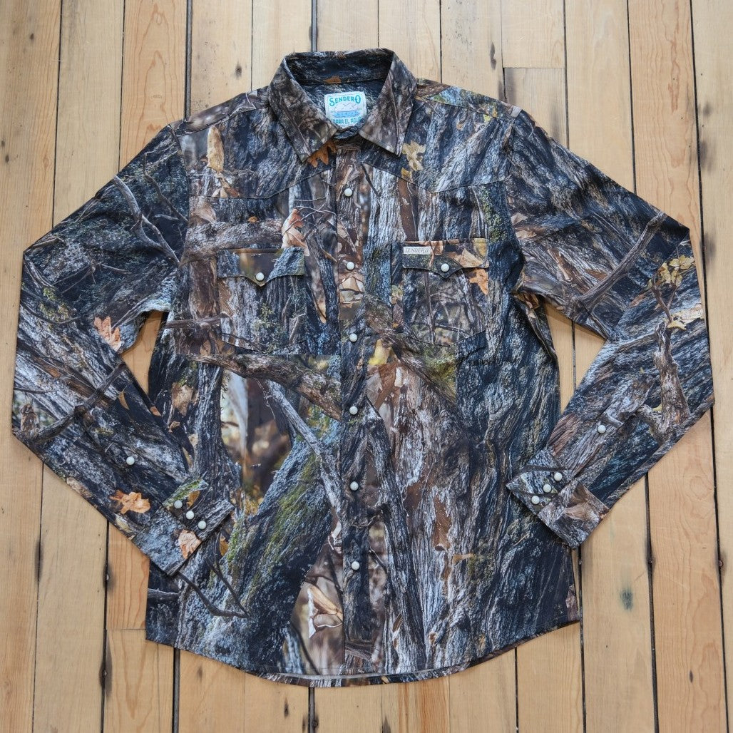 Sendero Confluence Tech Long Sleeve Shirt in Will Tree Camo featuring classic pearl snaps and a tailored western fit.