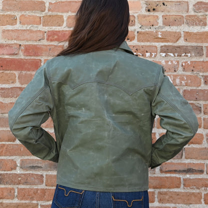 View of Schaefer ladies moss waxed canvas jacket with antique brass snaps and six pockets