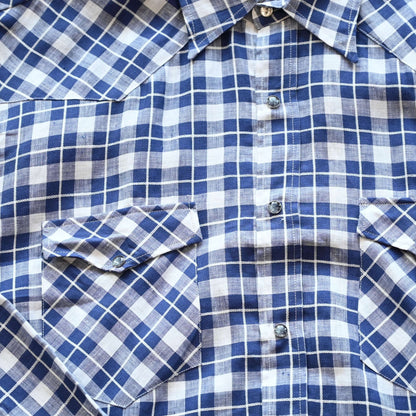 View of Blue Blanket men’s blue plaid linen Western shirt with pearl snaps and yoke detail