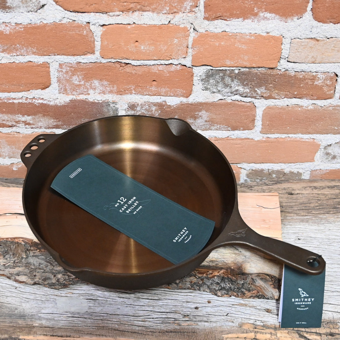 View of Smithey Ironware No. 12 Cast Iron Skillet with polished surface and ergonomic handle