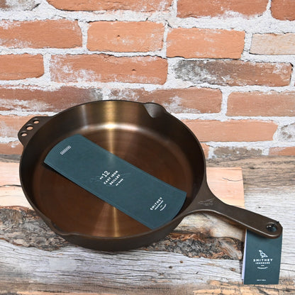 View of Smithey Ironware No. 12 Cast Iron Skillet with polished surface and ergonomic handle