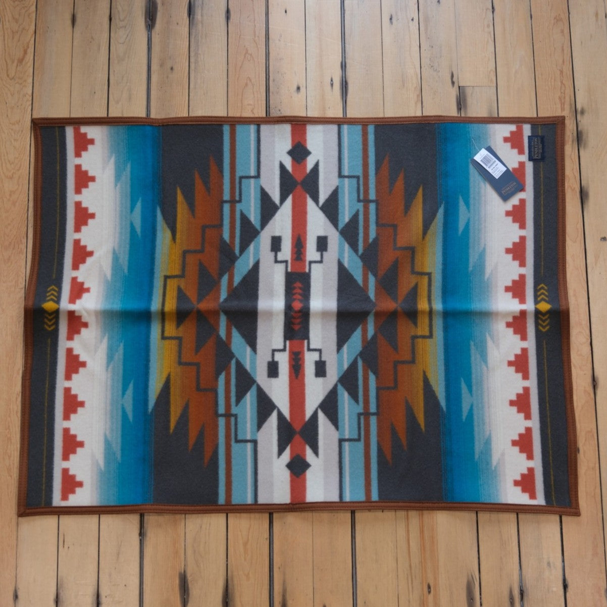 Nike N7 Seven Generations child-sized wool blanket in Turquoise by Pendleton.