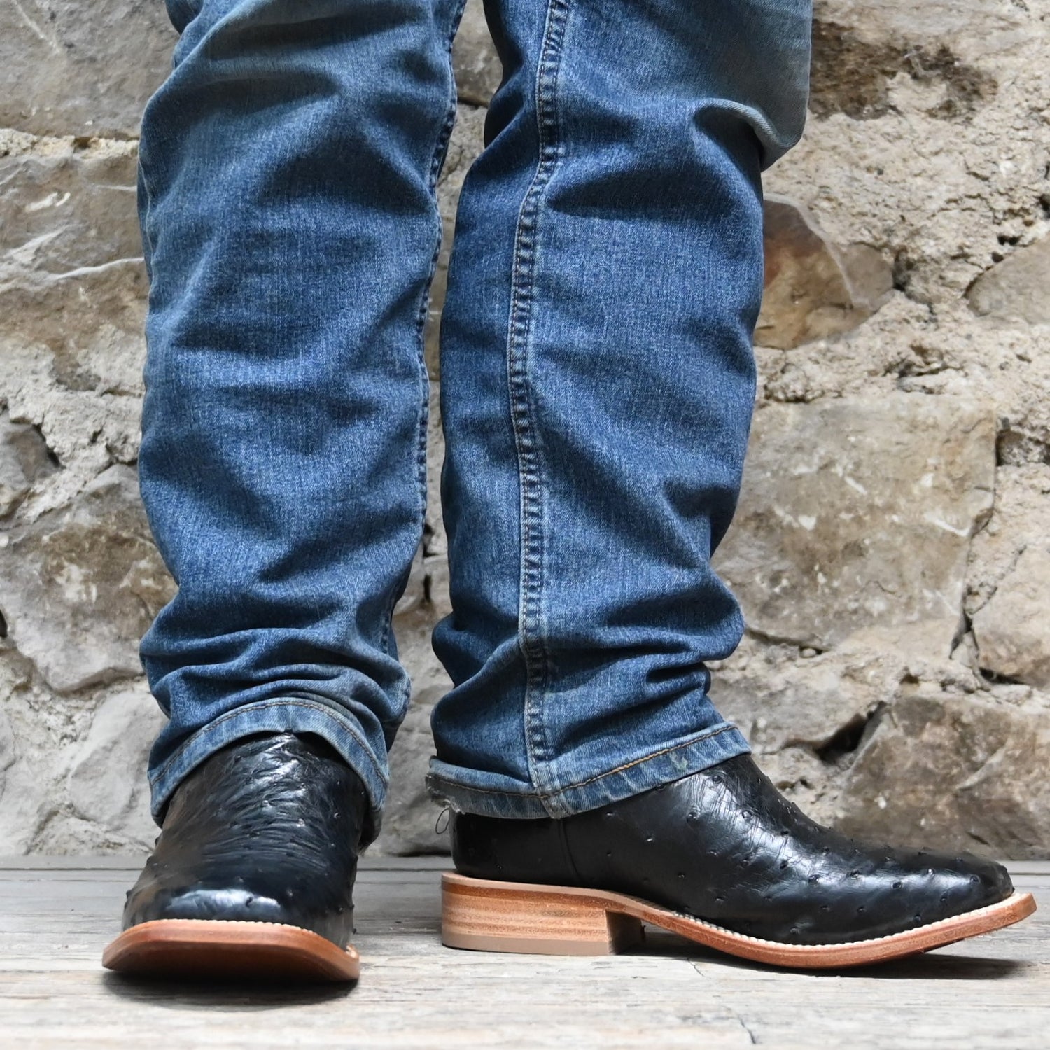 View of Hyer JETMORE 13&quot; boots showcasing black full-quill ostrich vamp and red vintage goat upper with broad square toe and Stockman block heel