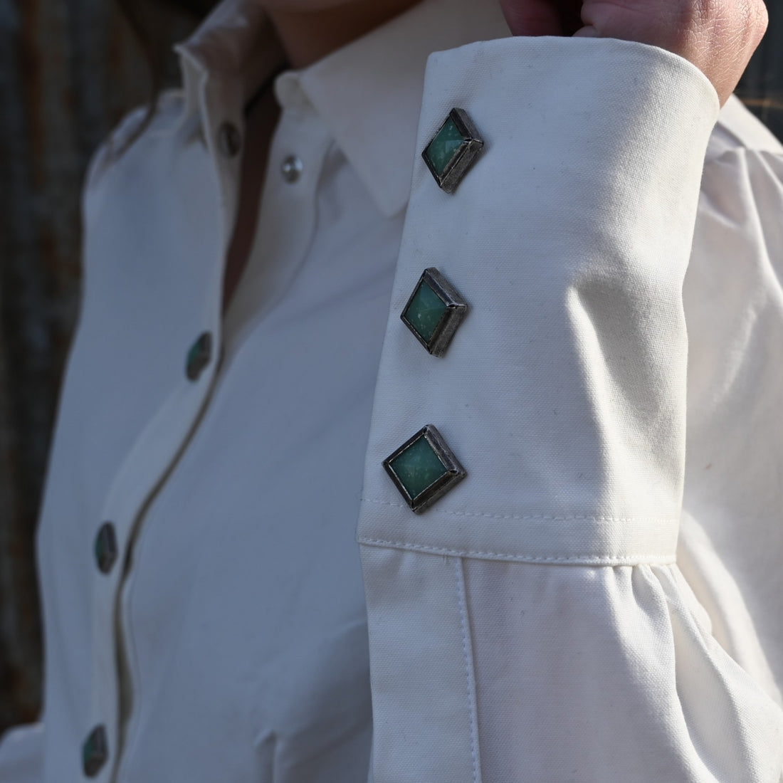 View of Blue Blanket ladies white Western cotton shirt with turquoise gem snaps and yoke detailing