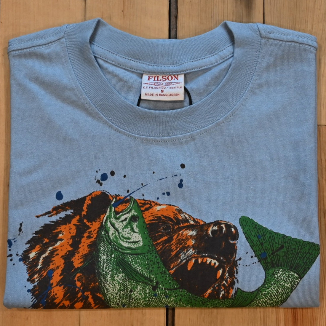 View of Filson Frontier Graphic T-Shirt featuring a custom bear fishing scene graphic