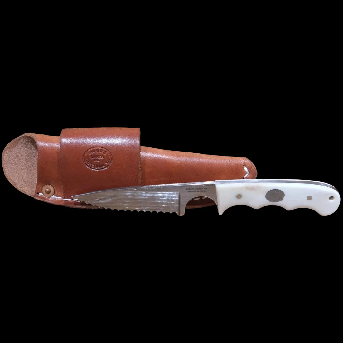Moore Maker Hay Cutter knife with serrated blade and white bone handle next to its leather sheath.