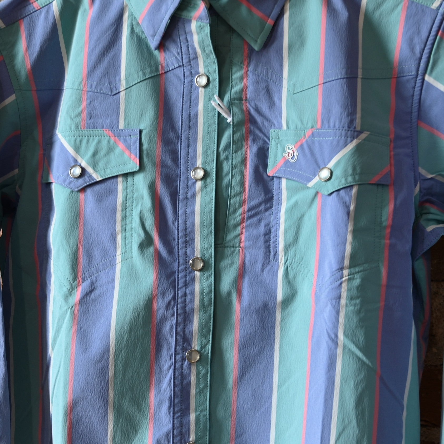 View of Schaefer ladies Marathon plaid Range Tek shirt with blue and green tones, mesh back vent, and snap pockets
