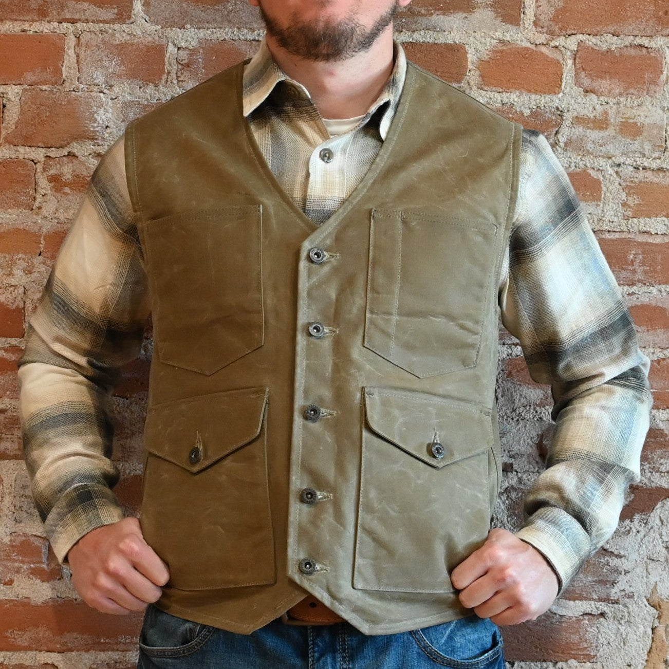 View of Schaefer waxed canvas Mesquite Vest in Saddle and Oak with four front pockets and Western yokes