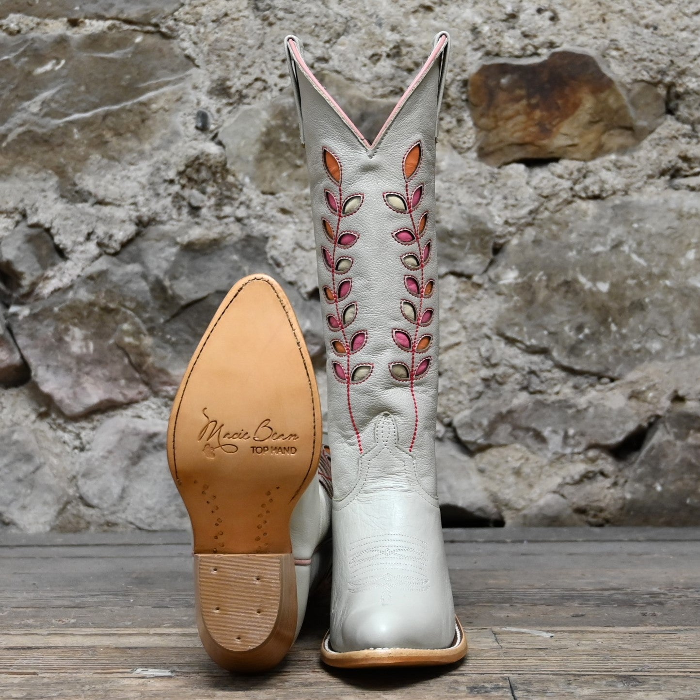 View of Macie Bean 15″ Cream Hotshot boot with almond vamp and citrus inlay shaft