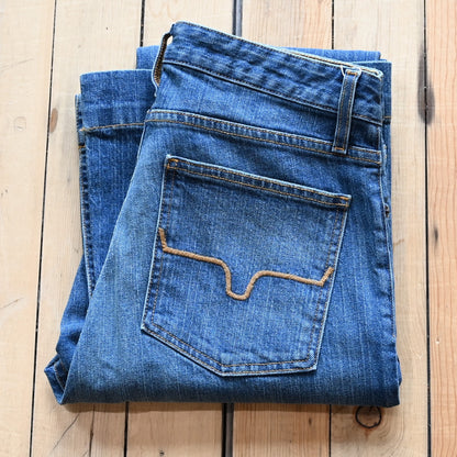 View of Kimes Ranch Jennifer Jeans in Mid Wash featuring a super wide flare leg with hand-sanding and whisker details