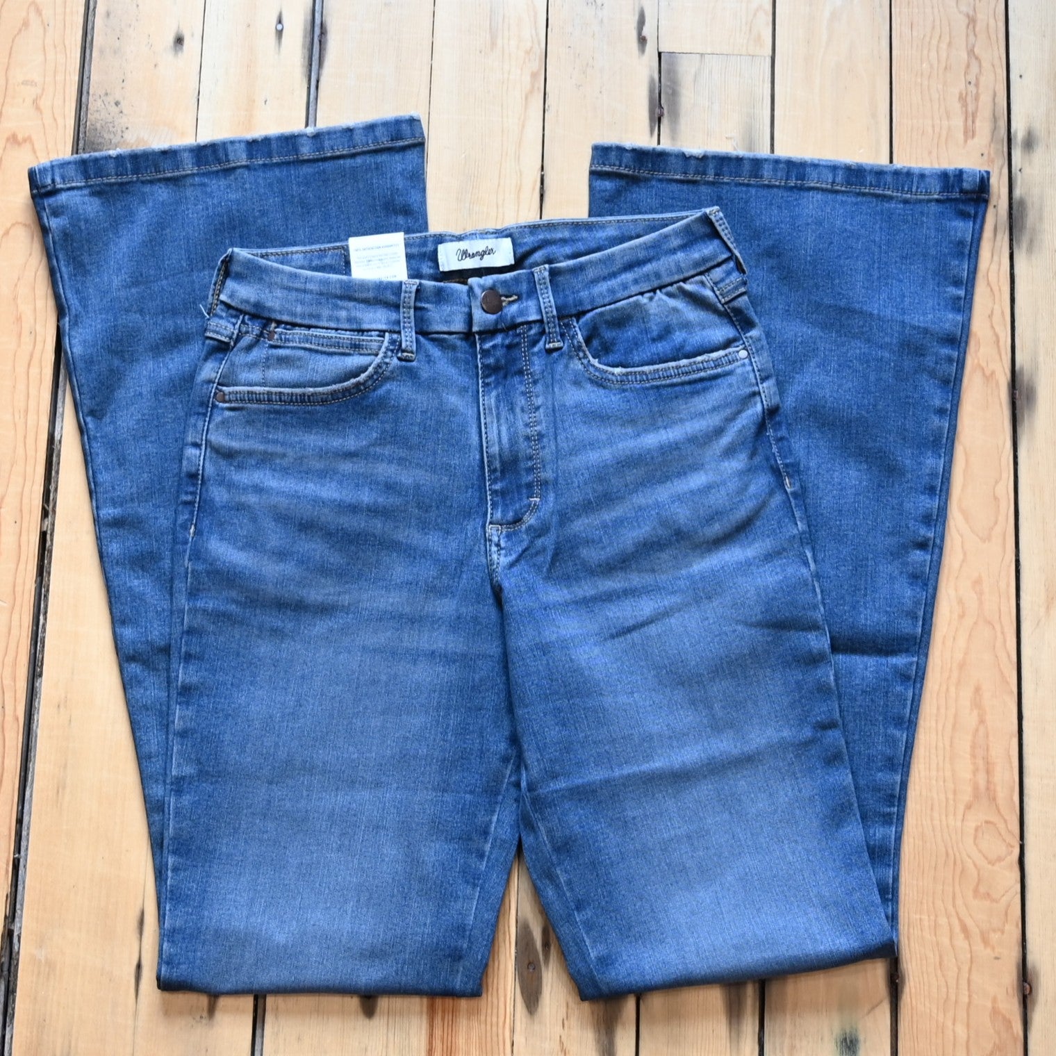 View of Wrangler Ladies flare jeans in Lily wash with high-rise waist and slim fit from the Bespoke Collection