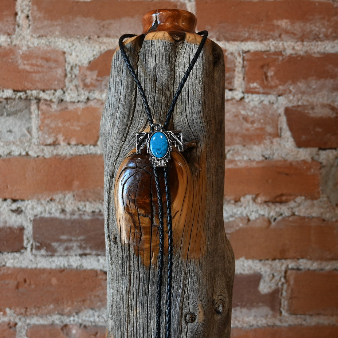 Rockmount Thunderbird Bolo Tie with silver thunderbird slide and large stone inlay on black leather cord
