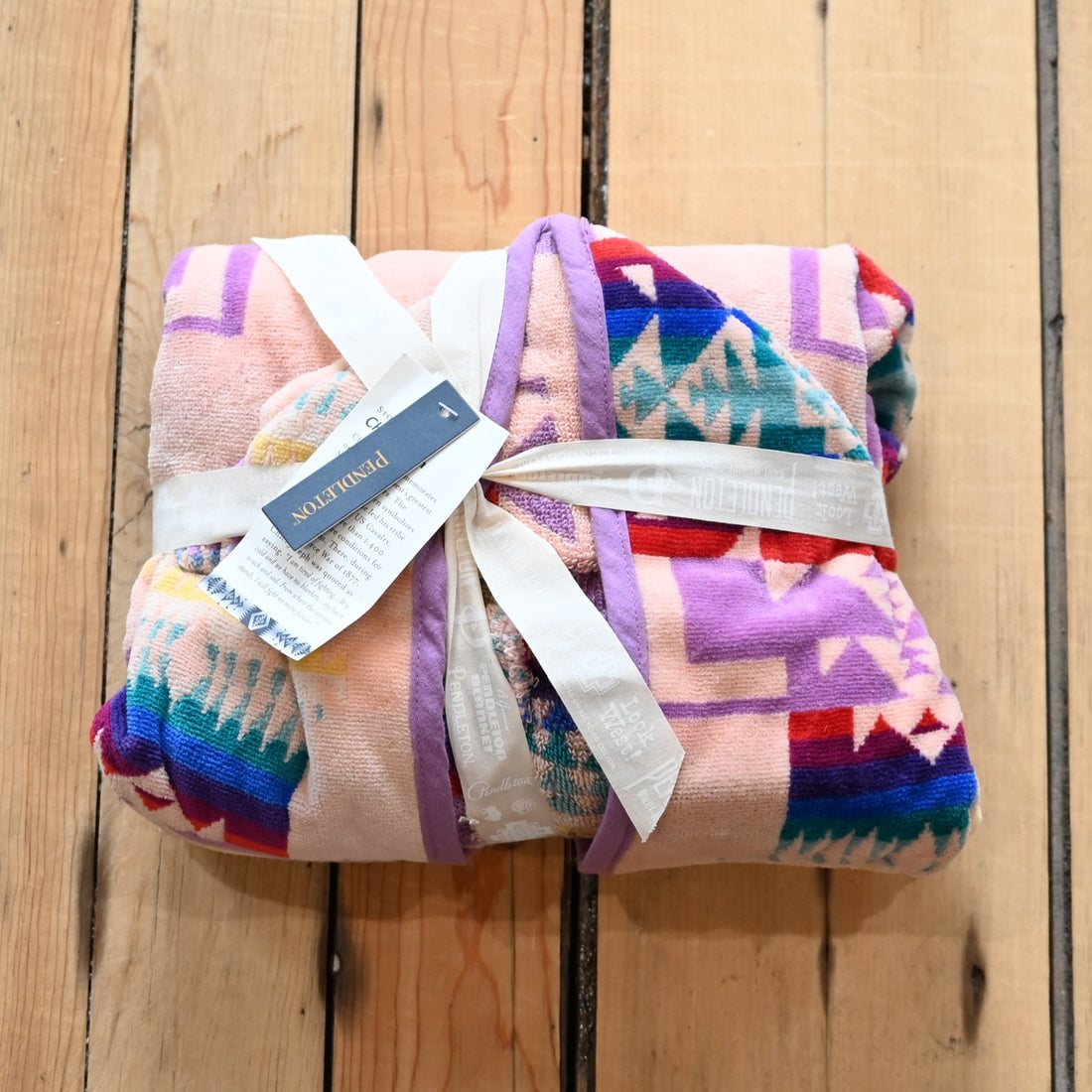 View of Pendleton pink child-sized hooded towel with Chief Joseph jacquard pattern and absorbent terry lining