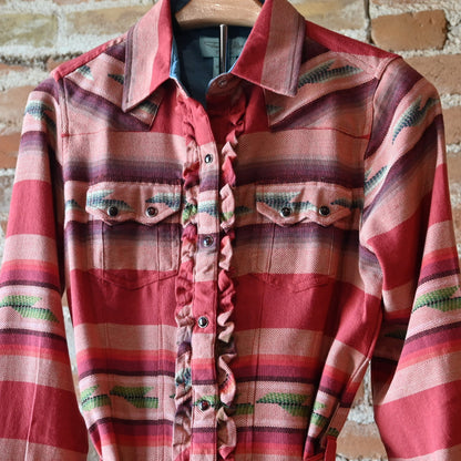 Ladies Colt 44 Tunic in rouge serape pattern with pearl snaps, self-tie belt, collar, and double breast pockets